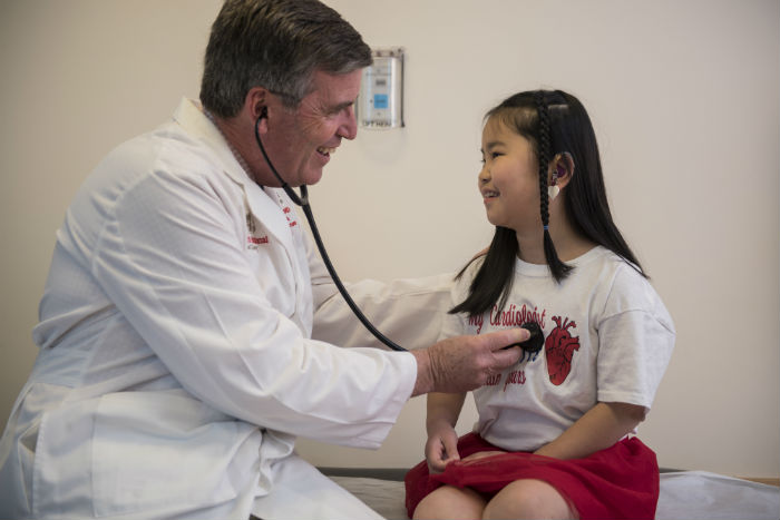 male cardiologist and female patient
