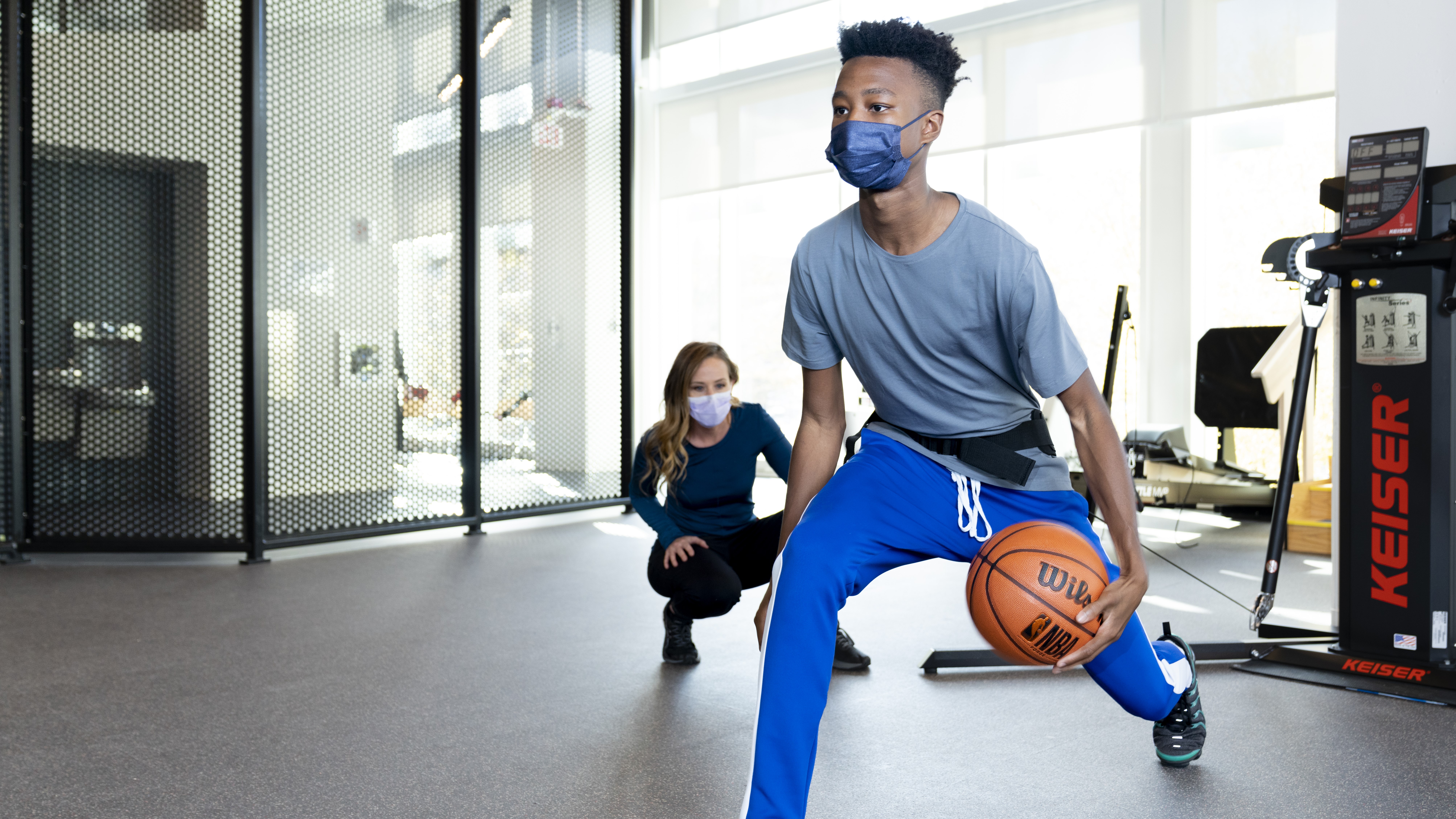 Teenager playing basketball